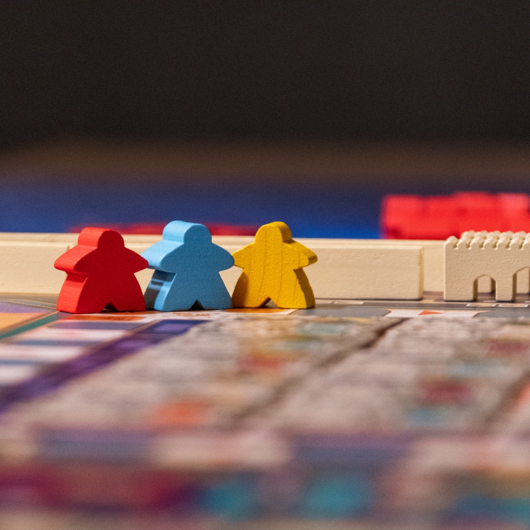 Meeples on a game board