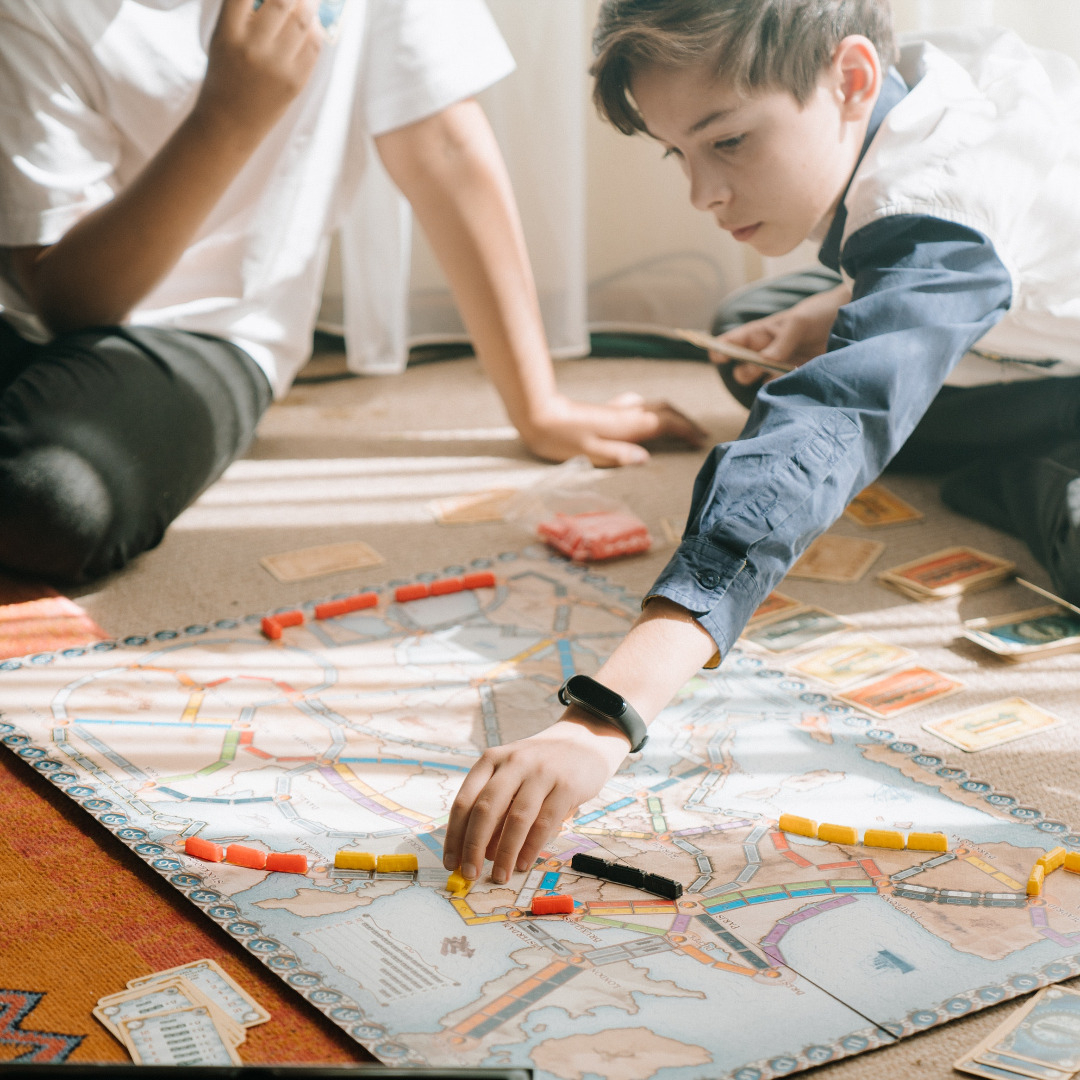 A family playing Ticket to Ride
